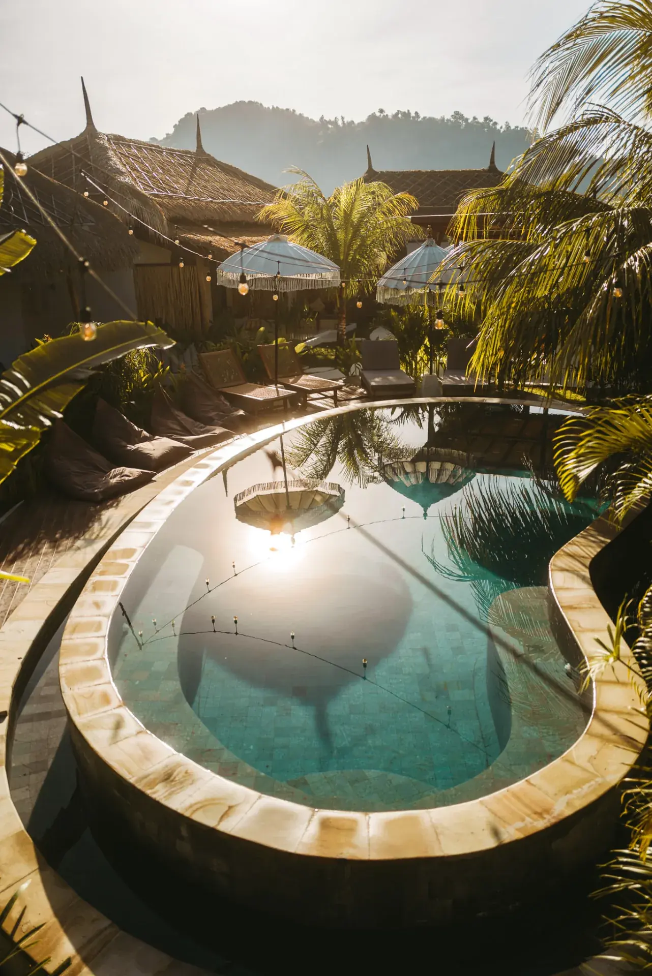 Swimming pool surrounded by tropical planting at Luana Lombok, Selong Belanak
